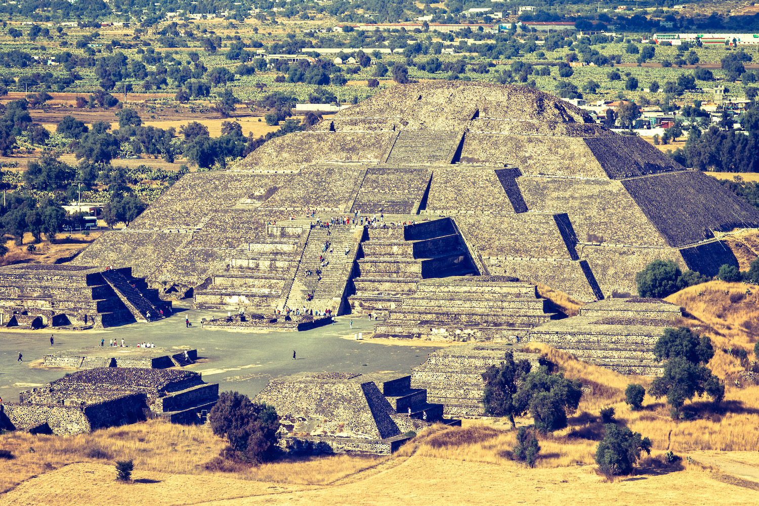 Vintage retro hipster style travel image of Pyramid of the Moon. View from the Pyramid of the Sun. Teotihuacan, Mexico
